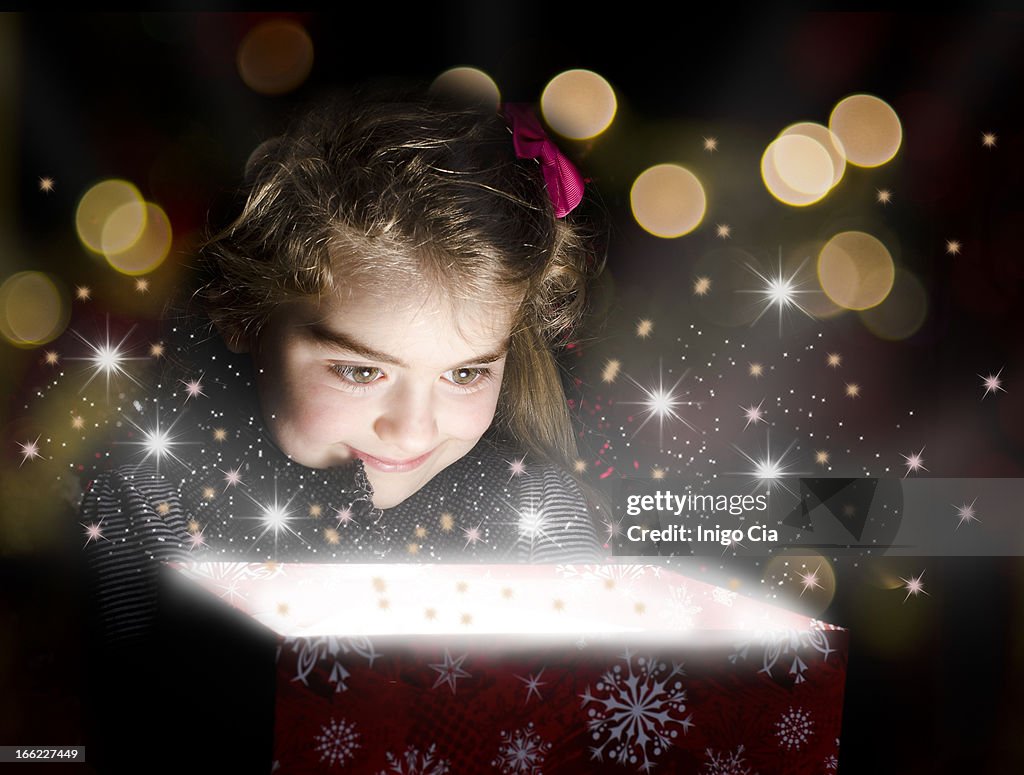 Child opening a magic box