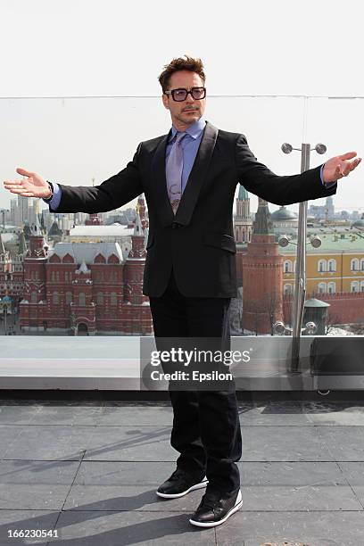 Actor Robert Downey Jr. Poses during a photocall on the roof of Ritz Carlston hotel for Russia Tour for 'Iron Man 3' on April 10, 2013 in Moscow,...