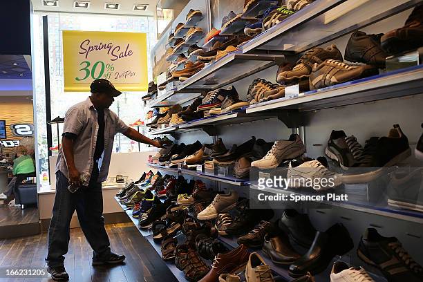 Person shops at a Skechers store on April 10, 2013 in New York City. The California-based footwear maker Skechers and nutritional products group...
