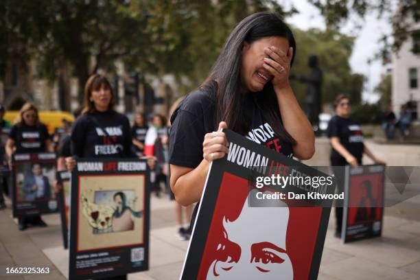 Woman is overcome with emotion as she leads the March on the first anniversary of the death of Mahsa Amini, on September 13, 2023 in London, England....
