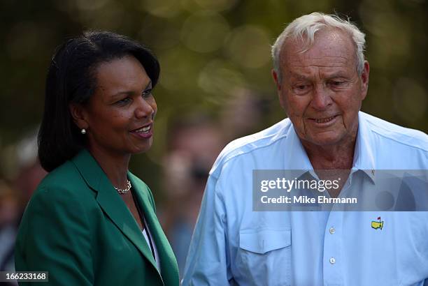 Former Secretary of State and Augusta National Golf Club member, Condoleezza Rice, talks with Arnold Palmer of the United States during the Par 3...