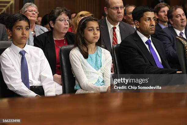 Principal Deputy Solicitor General of the United States Srikanth Srinivasan and his children, twins Vikram and Maya Srinivasan listen to members of...