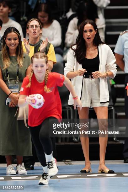 The Duchess of Sussex watching children on the basketball court at the Merkur Spiel-Arena during the Invictus Games in Dusseldorf, Germany. Picture...