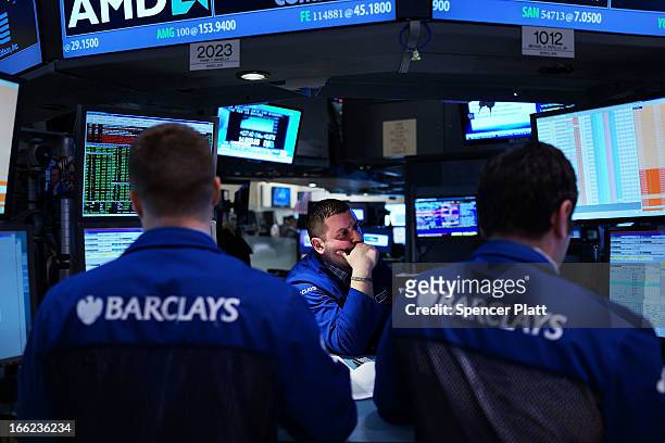 Traders work on the floor of the New York Stock Exchange at the end of the trading day on April 10, 2013 in New York City. The Dow Jones industrial...