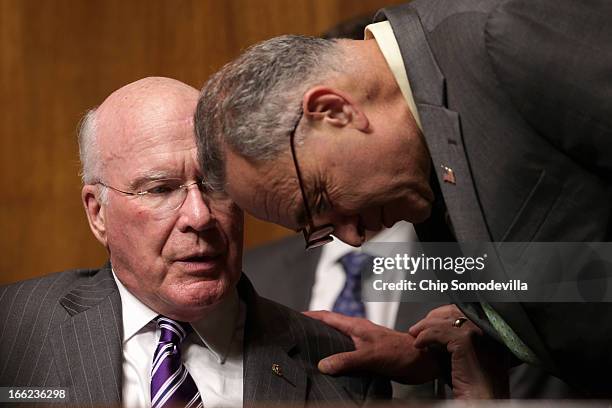 Senate Judiciary Committee Chairman Patrick Leahy talks with Sen. Charles Schumer during the confirmation hearing for Principal Deputy Solicitor...