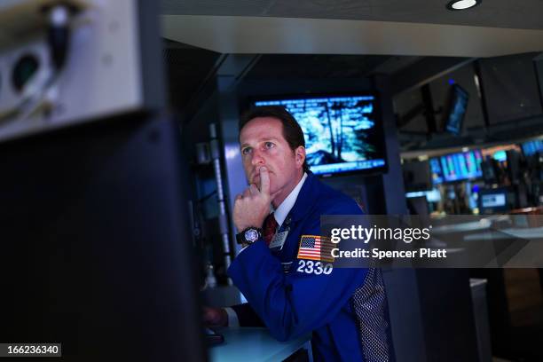 Trader works on the floor of the New York Stock Exchange at the end of the trading day on April 10, 2013 in New York City. The Dow Jones industrial...