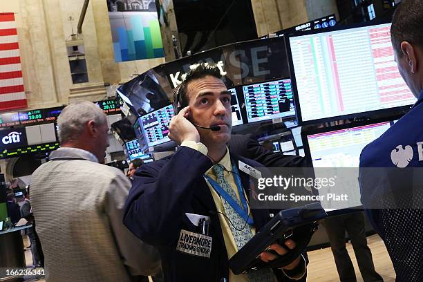 Traders work on the floor of the New York Stock Exchange at the end of the trading day on April 10, 2013 in New York City. The Dow Jones industrial...