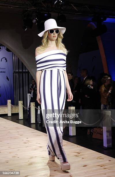 Model walks the runway during the Guido Maria Kretschmer For eBay Collection Launch at Label 2 on April 10, 2013 in Berlin, Germany.