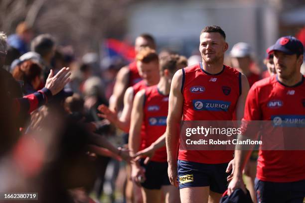 Steven May of the Demons greets fans during a Melbourne Demons AFL training session at Gosch's Paddock on September 06, 2023 in Melbourne, Australia.