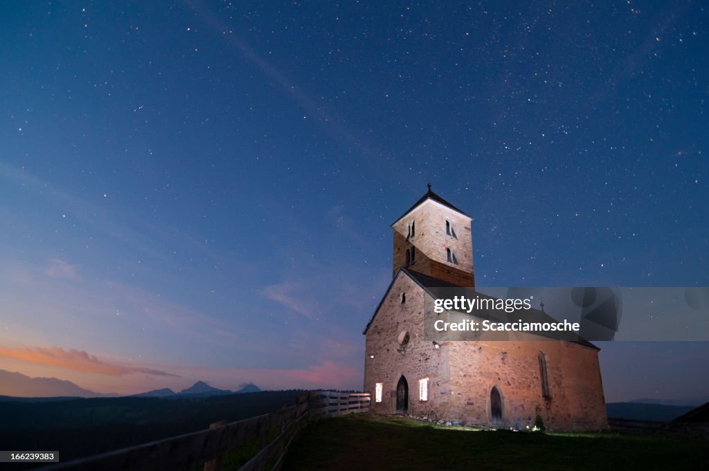 Ancient church in the mountains at night