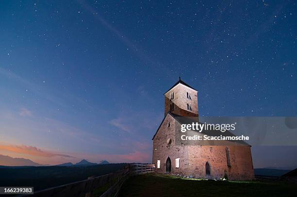 ancient church in the mountains at night - small chapel stock pictures, royalty-free photos & images