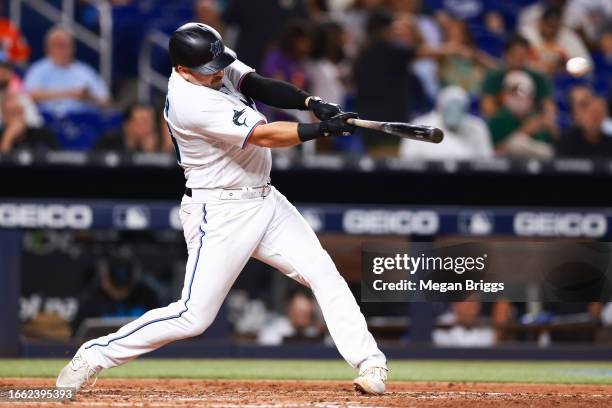 Jake Burger of the Miami Marlins hits a solo home run against the Los Angeles Dodgers in the fourth inning at loanDepot park on September 05, 2023 in...