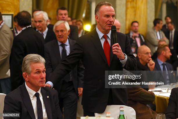 Karl-Heinz Rummenigge, CEO of Munich speaks to head coach Jupp Heynckes during the FC Bayern Muenchen gala dinner at the team squad Principi di...