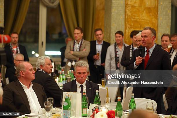 Karl-Heinz Rummenigge, CEO of Munich speaks to head coach Jupp Heynckes and Uli Hoeness , President of Munich during the FC Bayern Muenchen gala...