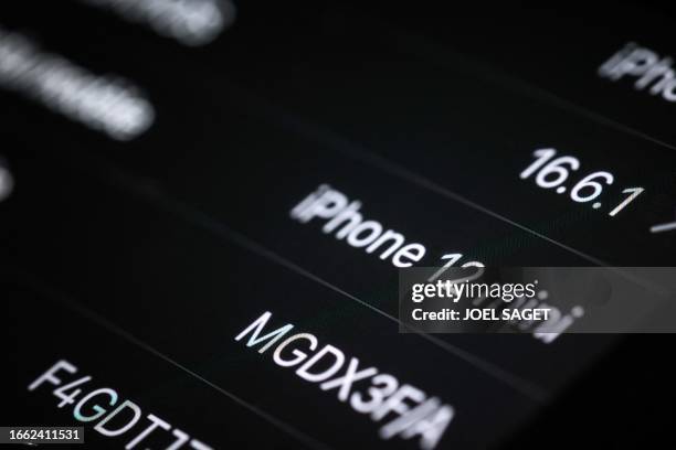 This photograph taken on on September 13 in Paris shows an Apple iPhone 12 screen, as French regulators ordered Apple to halt sales of the iPhone 12...