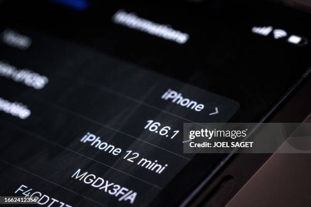 This photograph taken on on September 13 in Paris shows an Apple iPhone 12 screen, as French regulators ordered Apple to halt sales of the iPhone 12...