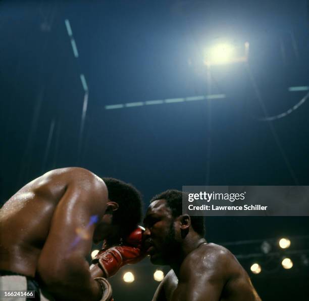 American boxers Muhammad Ali and Joe Frazier in close during their bout in the ring at Araneta Coliseum, Quezon City, Philippines, October 1, 1975....