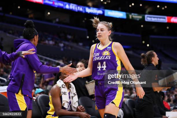 Guard Karlie Samuelson of the Los Angeles Sparks high-fives teammates in the first half against the Chicago Sky at Crypto.com Arena on August 29,...