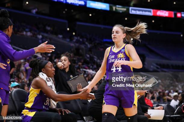 Guard Karlie Samuelson of the Los Angeles Sparks high-fives teammates in the first half against the Chicago Sky at Crypto.com Arena on August 29,...