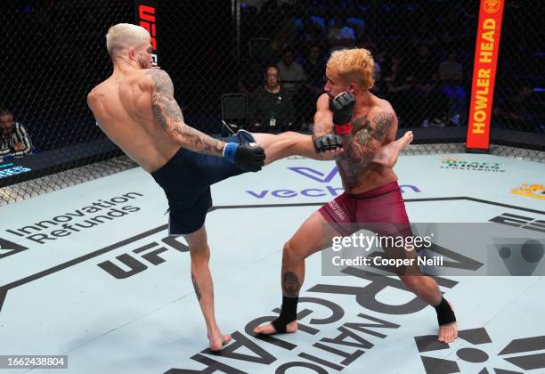 Serhiy Sidey of Ukraine kicks Ramon Taveras in a bantamweight fight during Dana White's Contender Series season seven, week five at UFC APEX on...