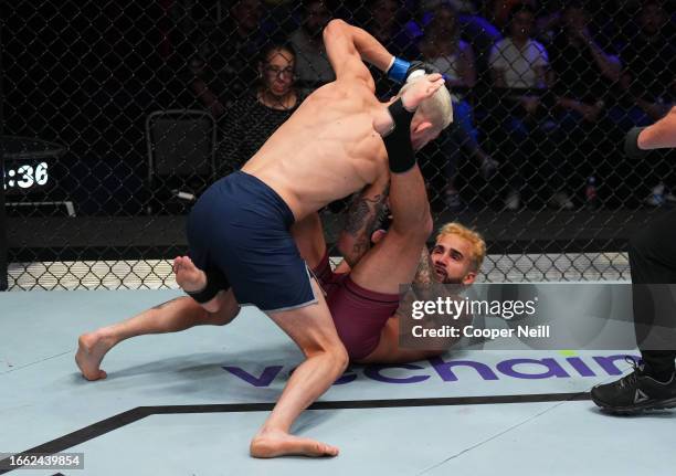 Serhiy Sidey of Ukraine punches Ramon Taveras in a bantamweight fight during Dana White's Contender Series season seven, week five at UFC APEX on...
