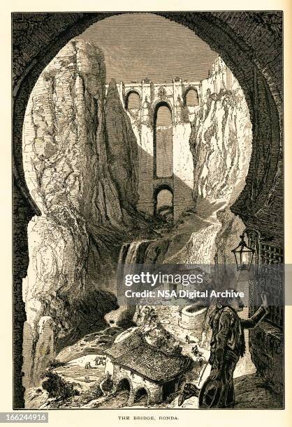 the bridge, ronda, spain (antique wood engraving) - ronda bridge stock illustrations