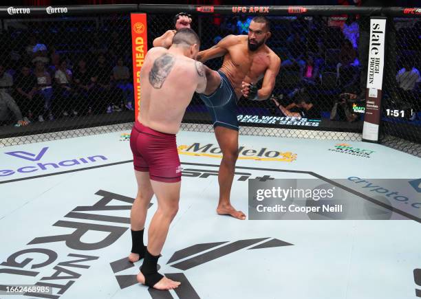 Brendson Ribeiro of Brazil kicks Bruno Lopes of Brazil in a light heavyweight fight during Dana White's Contender Series season seven, week five at...