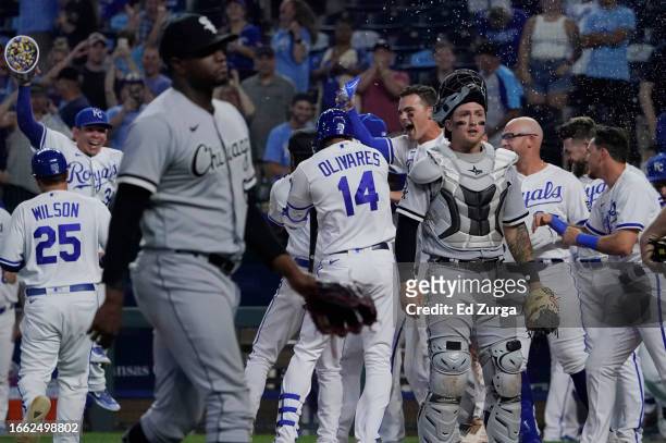 Kansas City Royals celebrate as Korey Lee of the Chicago White Sox reacts to a walk-off balk called on Gregory Santos of the Chicago White Sox in the...