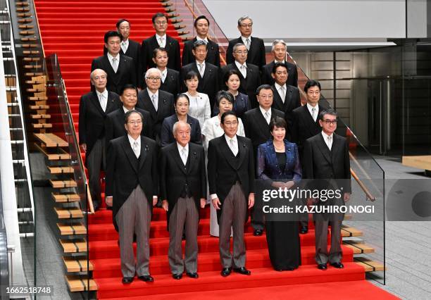 Japan's Prime Minister Fumio Kishida and his new cabinet pose for a photo at the prime minister's official residence in Tokyo on September 13, 2023....