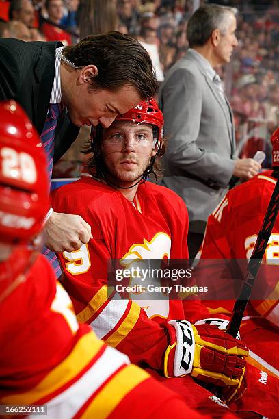 Assistant Coach Martin Gelinas has a discussion with Max Reinhart of the Calgary Flames during the game against the Vancouver Canucks on April 10,...