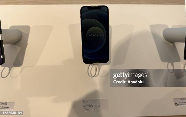 View of iPhone 12 with a note of 'Not for sale' at Apple's store following the sale of iPhone 12 model phones is banned in Paris, France on September...