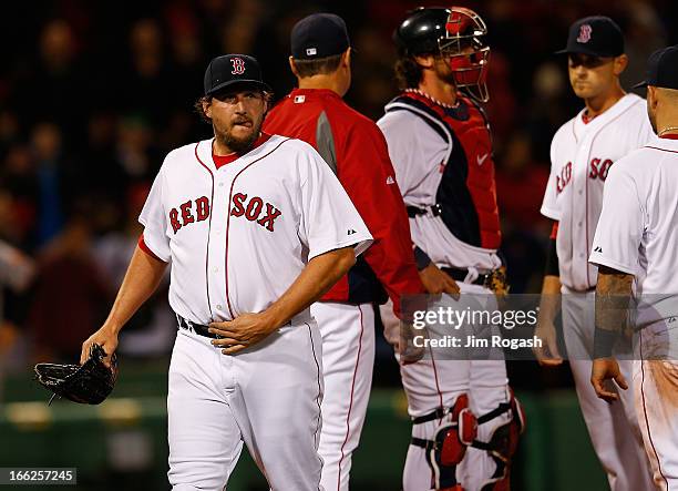 Joel Hanrahan of the Boston Red Sox leaves the game after giving up a three-run home run to Manny Machado of the Baltimore Orioles in the ninth...