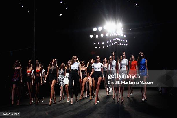 Reflection of models showcasing designs on the runway at the Suboo show during Mercedes-Benz Fashion Week Australia Spring/Summer 2013/14 at...