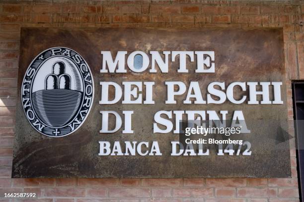 Signage for Banca Monte dei Paschi di Siena SpA at the entrance of a bank branch in San Rocco a Pilli, province of Siena, Italy, on Tuesday, Sept....