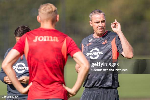 Michael Duff Manager of Swansea City gives instructions to the players during the Swansea City AFC Training Session at The Fairwood Training Ground...