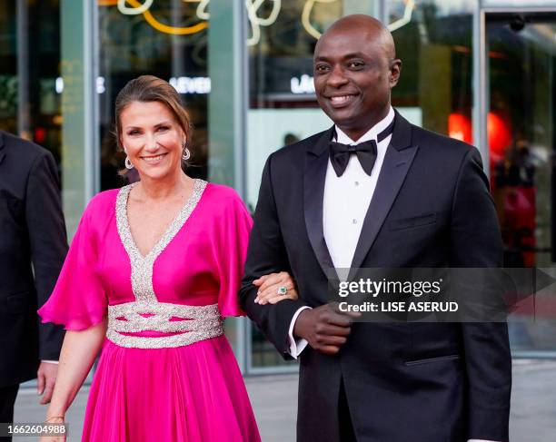 This picture taken on June 16, 2022 shows Norway's Princess Martha Louise and her American fiancé Durek Verrett after the government's festive event...