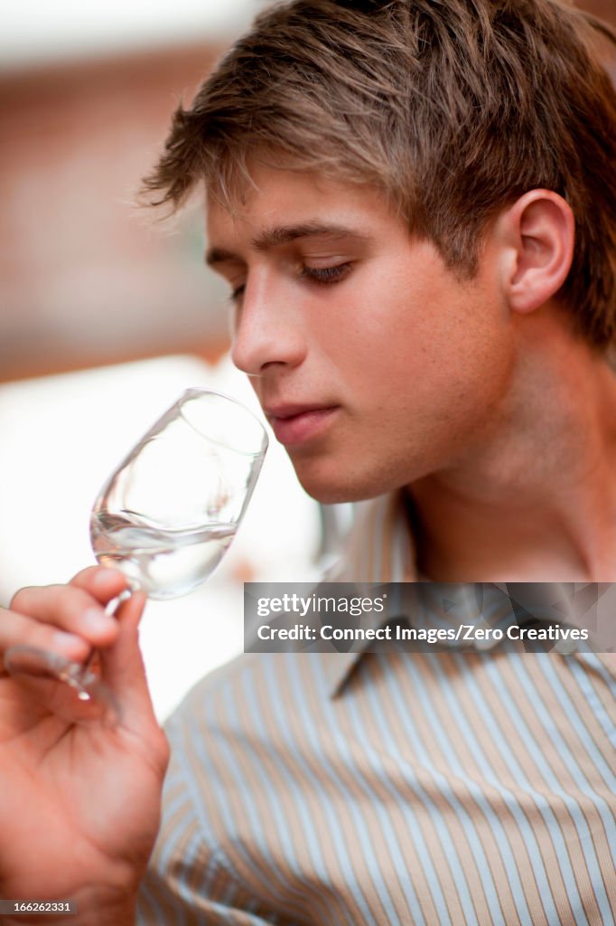 Man tasting wine in grocery