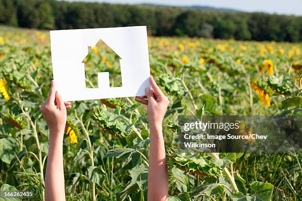 woman holding card with house shape - hungary countryside stock pictures, royalty-free photos & images