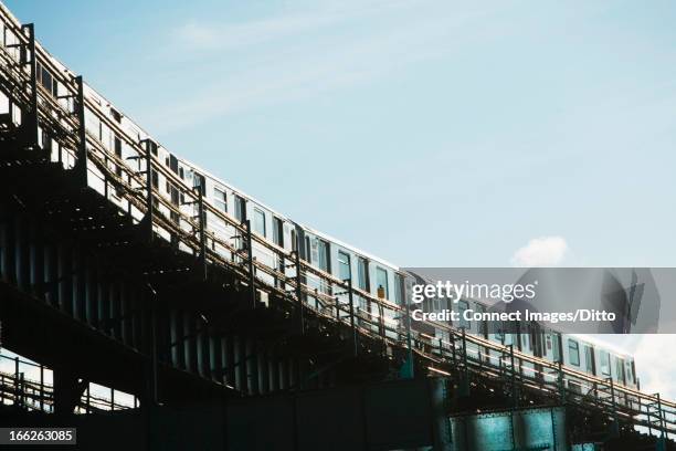 urban train on elevated tracks - elevated railway track stock pictures, royalty-free photos & images