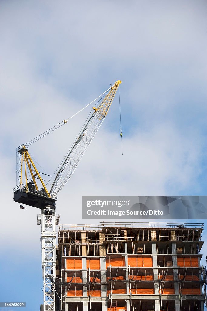 Crane over building in construction