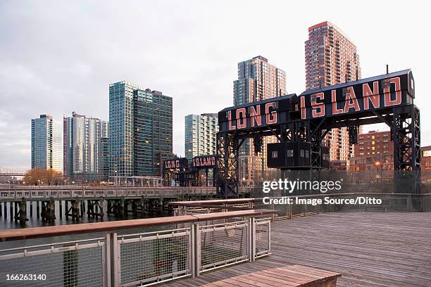 long island sign on wooden pier - long island stockfoto's en -beelden