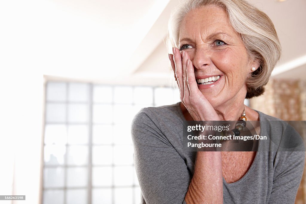 Smiling older woman gasping