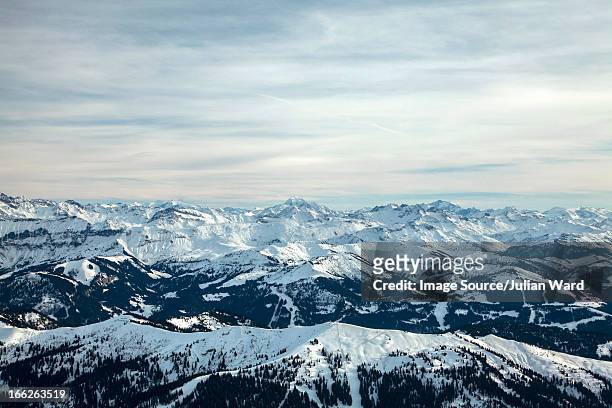 aerial view of snowy mountains - la clusaz stock pictures, royalty-free photos & images