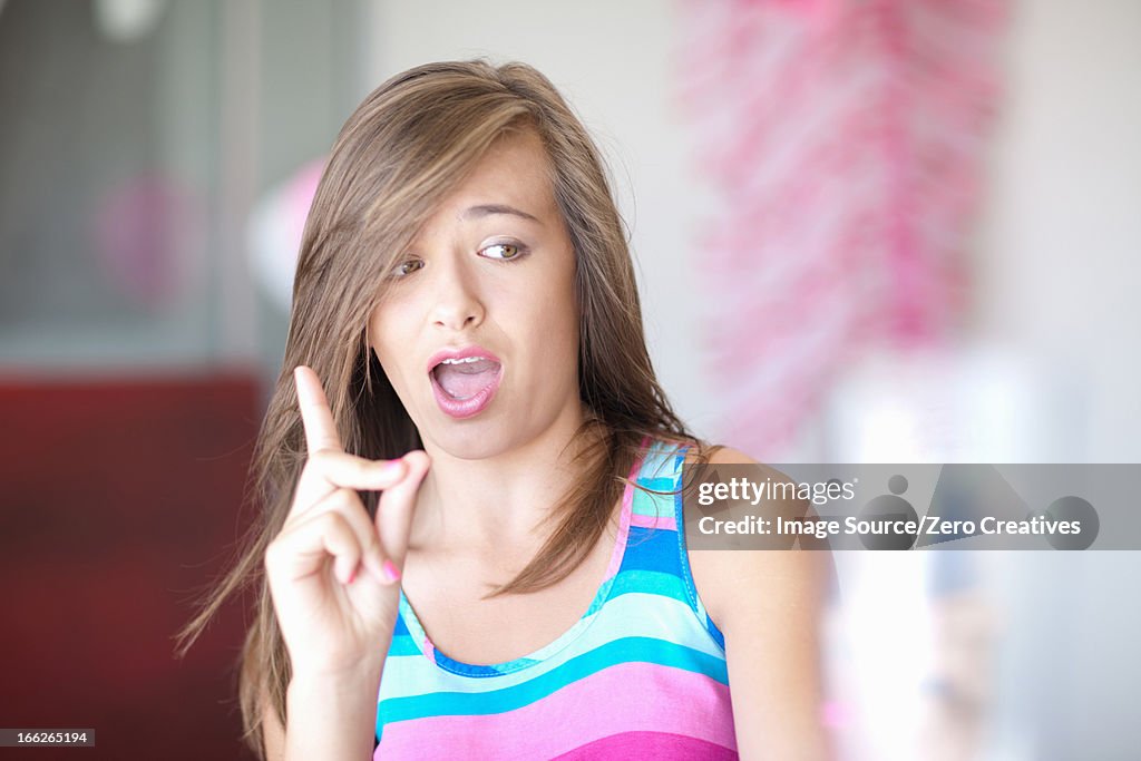 Teenage girl wagging a finger