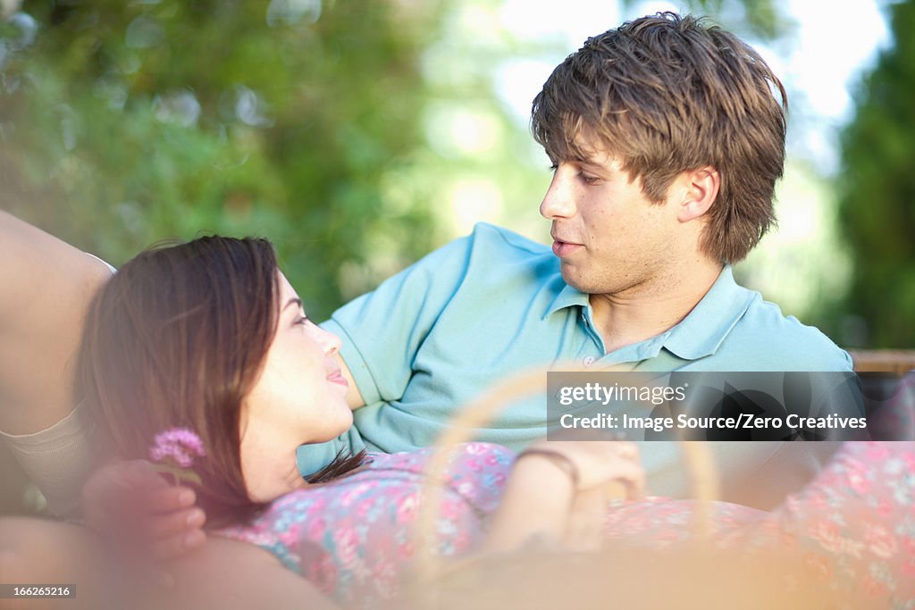 Smiling couple relaxing in park