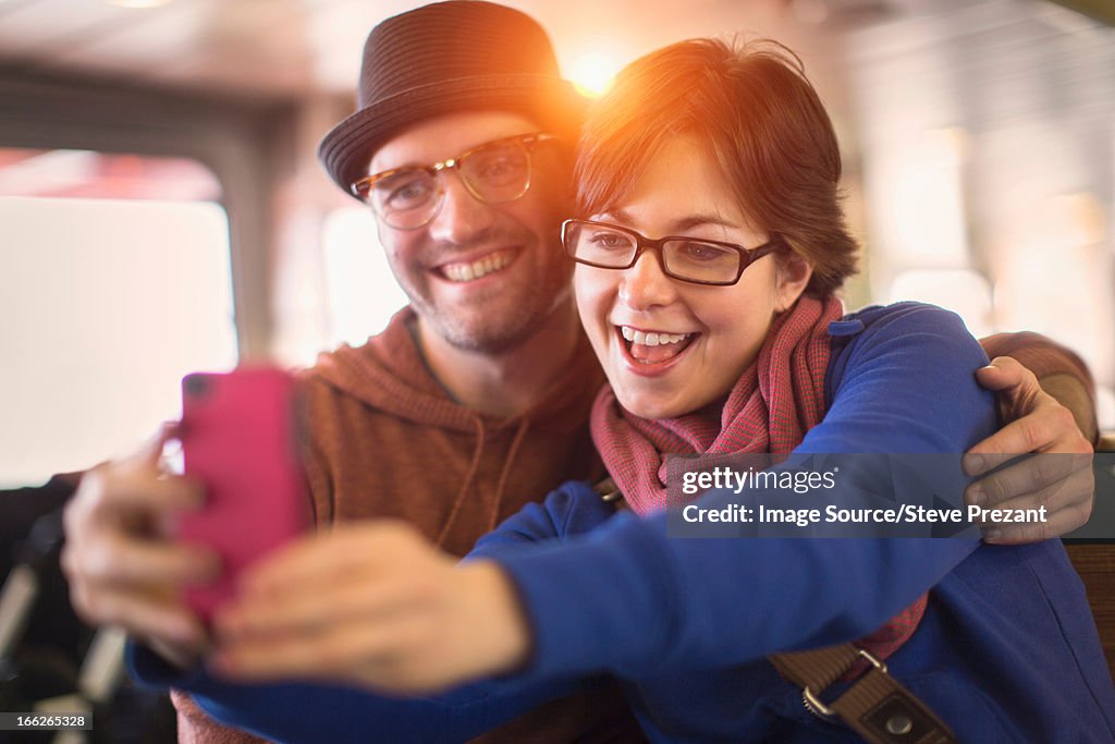 Couple taking picture with cell phone