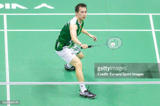 Ng Ka Long Angus of Hong Kong competes in the Men's Single match against Jonatan Christie of Indonesia during day two of the Victor Hong Kong Open at...