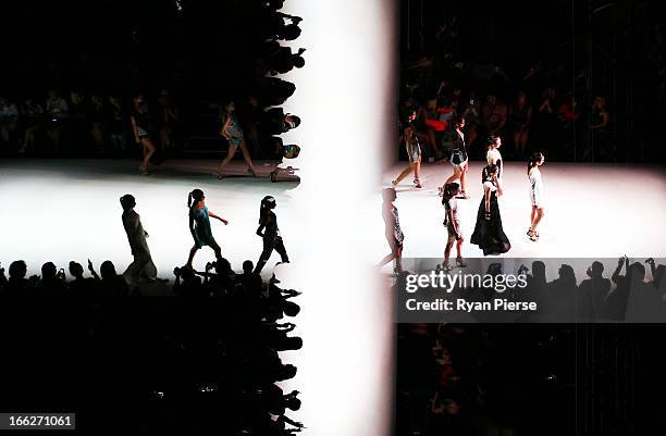 Models showcase designs on the runway at the Bless'ed Are The Meek show during Mercedes-Benz Fashion Week Australia Spring/Summer 2013/14 at...