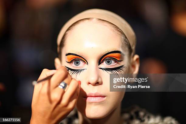 Models prepare backstage for the Romance Was Born show during Mercedes-Benz Fashion Week Australia Spring/Summer 2013/14 at Carriageworks on April 8,...