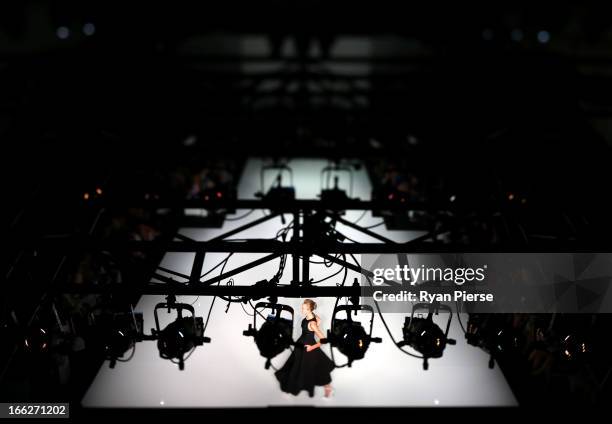 Model showcases designs on the runway at the Maticevski show during Mercedes-Benz Fashion Week Australia Spring/Summer 2013/14 at Carriageworks on...